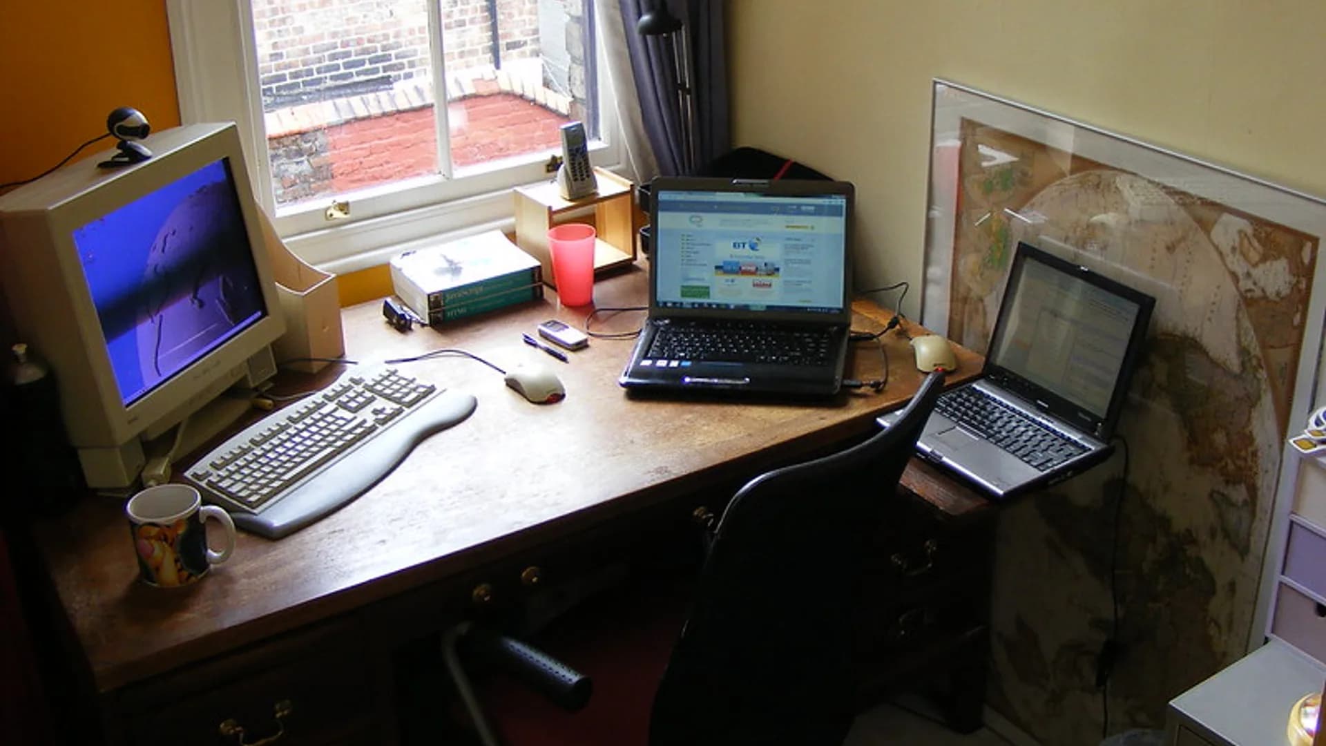 Person using AI productivity software on a laptop at a tidy office desk